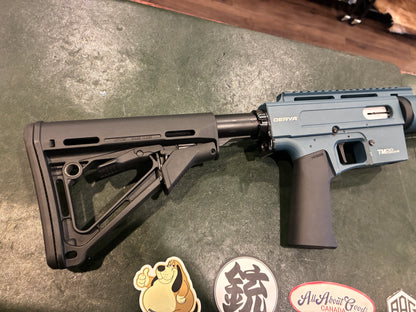Derya TM22 A-18 Semi-Automatic Rifle – .22 LR – Blue Aluminum Receiver – Magpul Stock – Includes Two Magazines